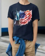 Statue of Liberty T-shirt with USA Flag Art - model wearing navy shirt, hands in pockets