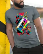 Retro Cassette Tape T-shirt with Color Splash Art - model in grey shirt leaning against column