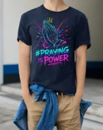 Praying Hands Faith Power Graphic T-shirt - model wearing navy shirt, hands in pockets