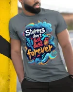 Storms Don’t Last Forever Motivational T-shirt - model in grey shirt leaning against column