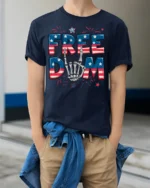 Freedom Skeleton Hand USA Flag T-Shirt - model wearing navy shirt, hands in pockets