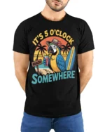 It’s 5 O’Clock Somewhere Beach T-Shirt - model wearing black shirt, hands behind back