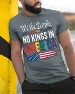 No Kings in America Patriotic Pride T-Shirt - model in grey shirt leaning against column