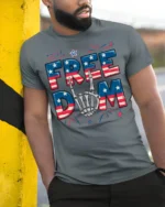 Freedom Skeleton Hand USA Flag T-Shirt - model in grey shirt leaning against column