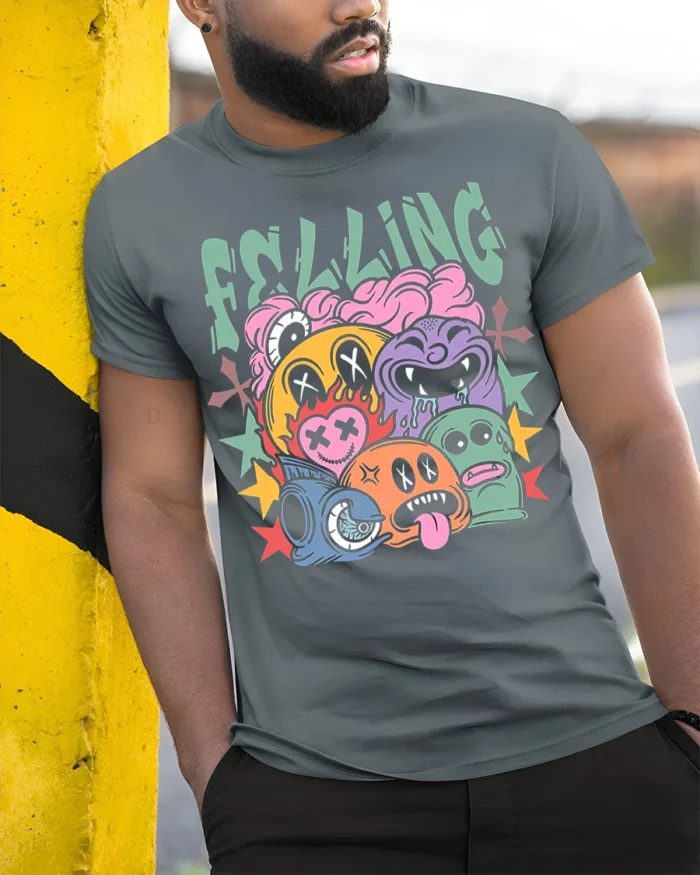 Colorful Cartoon Faces Street Art Graphic T-Shirt - model in grey shirt leaning against column