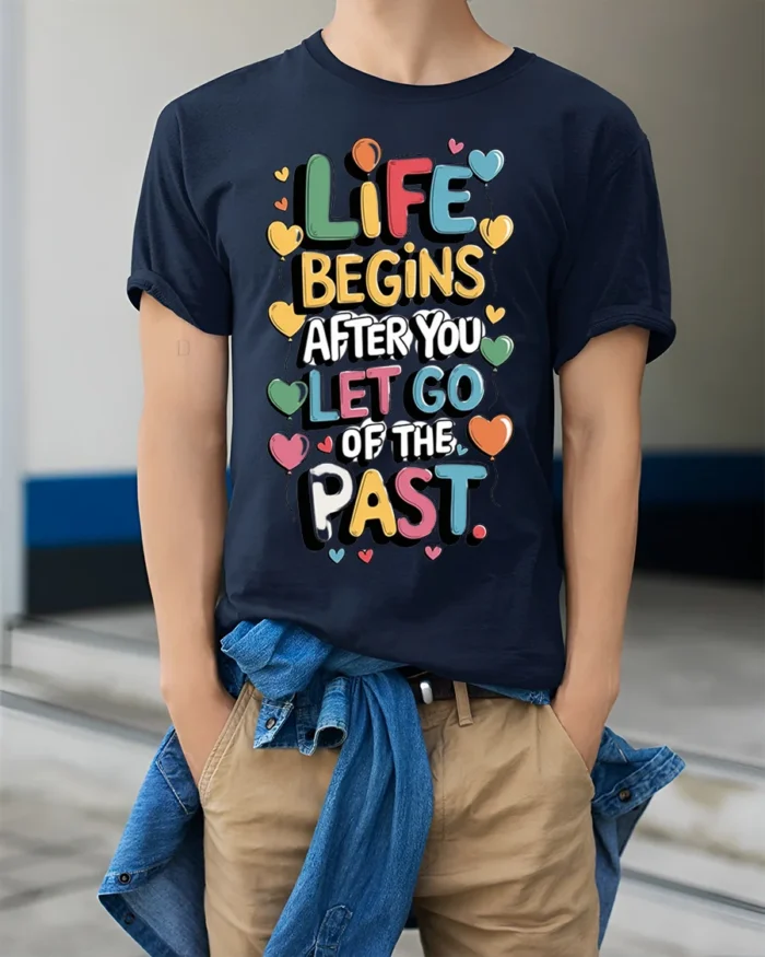 Life Begins Let Go of the Past Motivational T-Shirt - model wearing navy shirt, hands in pockets