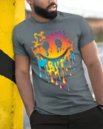Melting Neon Smiley Face Dripping Art T-Shirt - model in grey shirt leaning against column