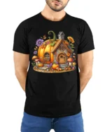 Whimsical Pumpkin Cottage Autumn T-Shirt - model wearing black shirt, hands behind back