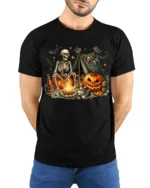 Skeleton Pumpkin Campfire Halloween T-Shirt - model wearing black shirt, hands behind back