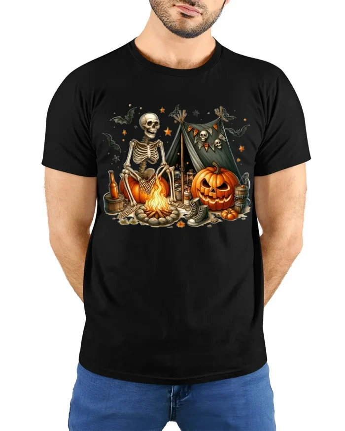 Skeleton Pumpkin Campfire Halloween T-Shirt - model wearing black shirt, hands behind back