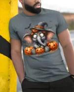 Cute Halloween Elephant Pumpkin T-Shirt - model in grey shirt leaning against column