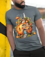 Whimsical Pumpkin House Autumn Harvest T-Shirt - model in grey shirt leaning against column