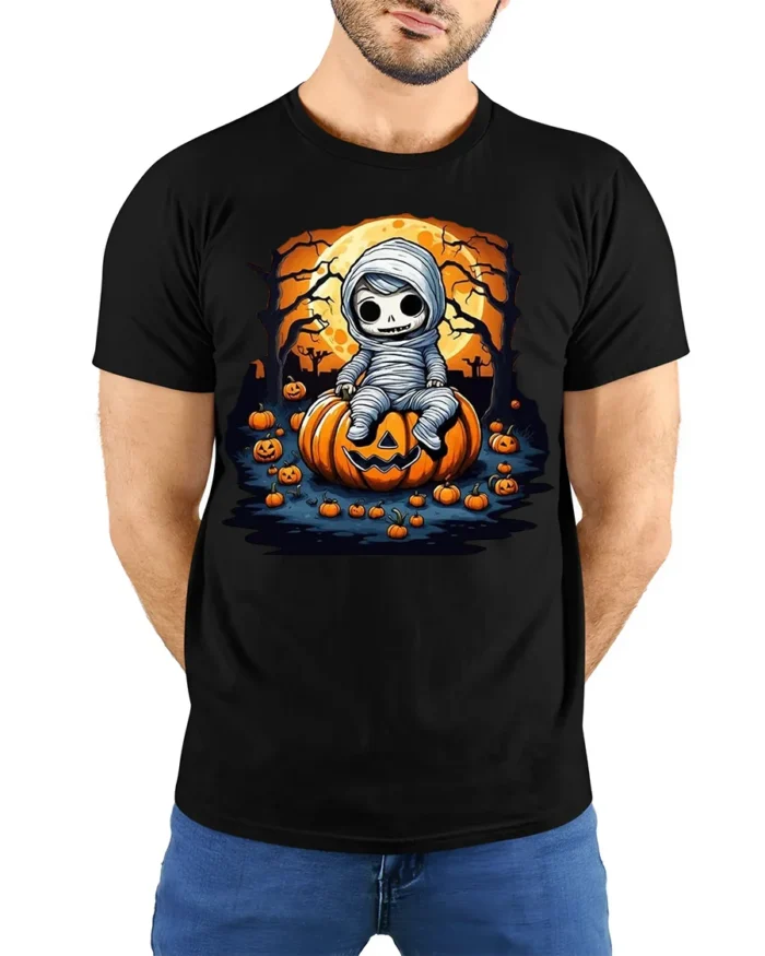 Cute Baby Mummy Sitting on Pumpkin Halloween T-shirt - model wearing black shirt, hands behind back