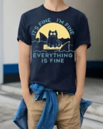 Funny Cat Everything Is Fine Graphic T-shirt - model wearing navy shirt, hands in pockets