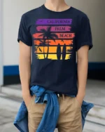 California Palm Beach Sunset Surf Graphic T-shirt - model wearing navy shirt, hands in pockets