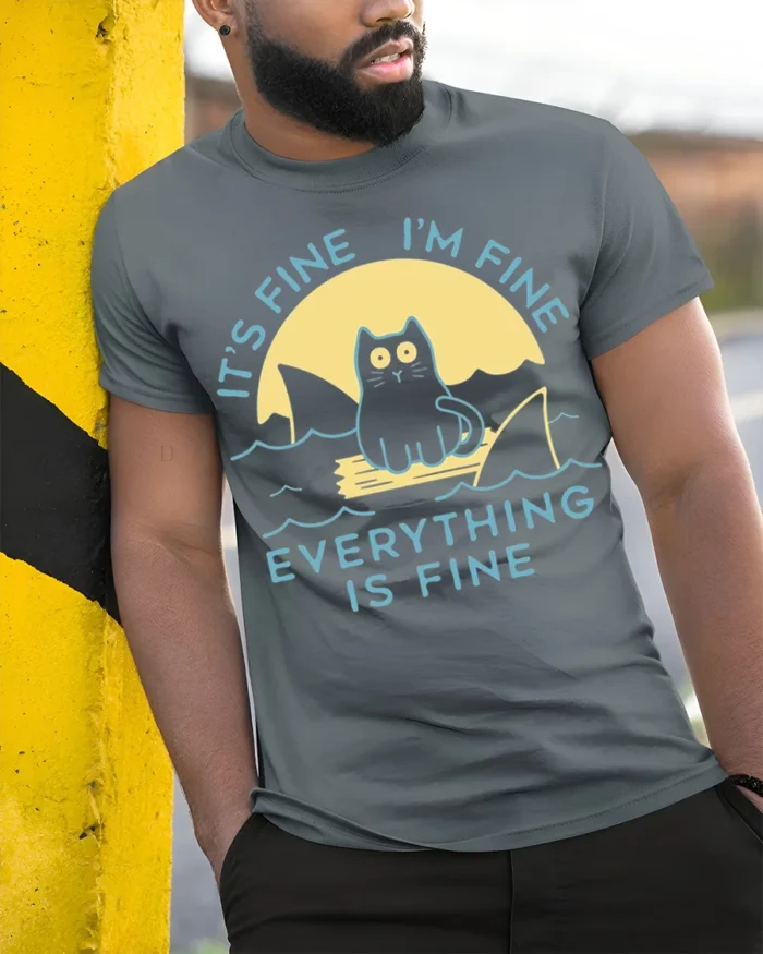 Funny Cat Everything Is Fine Graphic T-shirt - model in grey shirt leaning against column