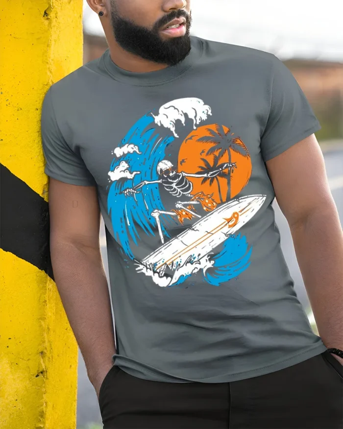 Skeleton Surfing Big Wave Sunset Graphic T-shirt - model in grey shirt leaning against column