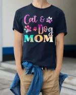 Colorful Cat and Dog Mom Paw Print Graphic T-shirt - model wearing navy shirt, hands in pockets