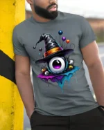 Witch Hat Eyeball Halloween Dripping Graphic T-shirt - model in grey shirt leaning against column