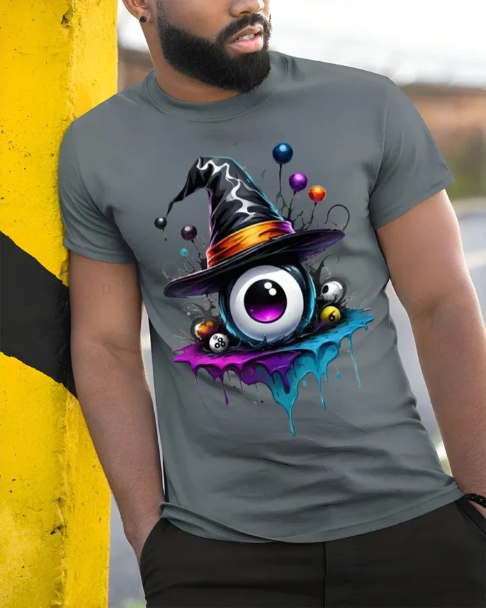 Witch Hat Eyeball Halloween Dripping Graphic T-shirt - model in grey shirt leaning against column