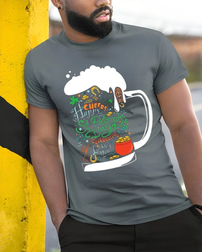St. Patrick’s Day Beer Mug Cheers Graphic T-shirt - model in grey shirt leaning against column