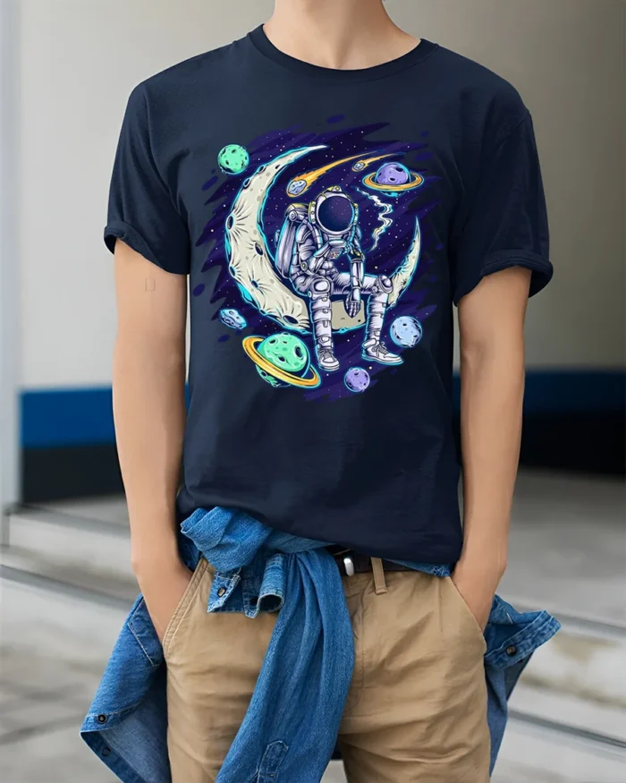 Astronaut Sitting on Moon Space Planets T-shirt - model wearing navy shirt, hands in pockets