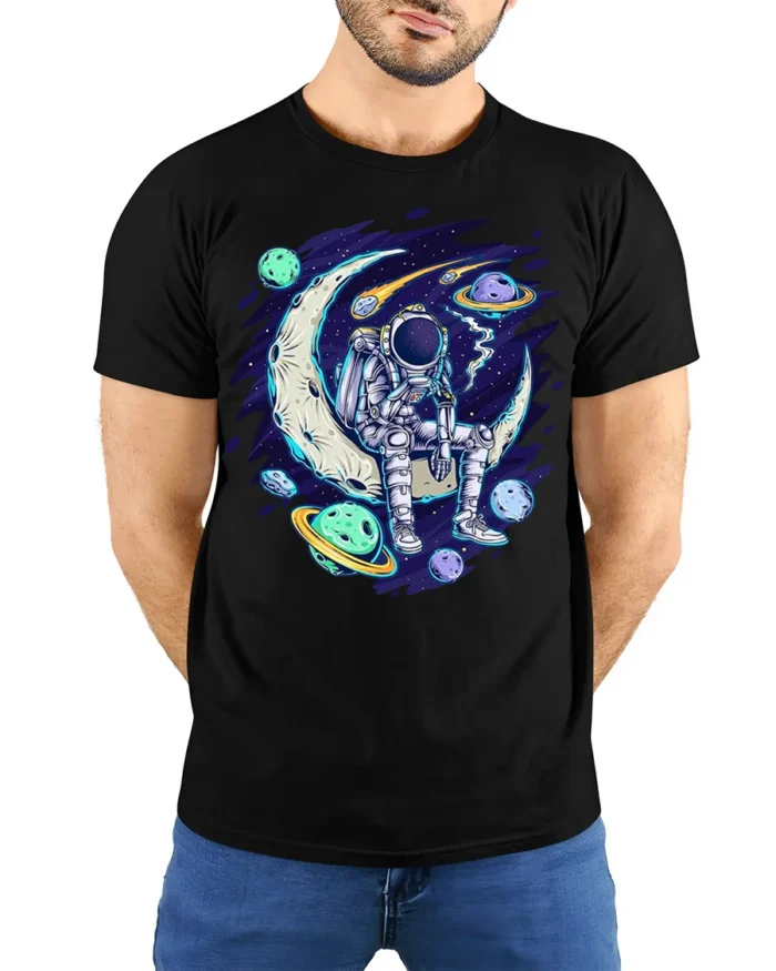 Astronaut Sitting on Moon Space Planets T-shirt - model wearing black shirt, hands behind back