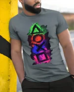 Colorful Gamer Controller Symbols Graphic T-shirt - model in grey shirt leaning against column