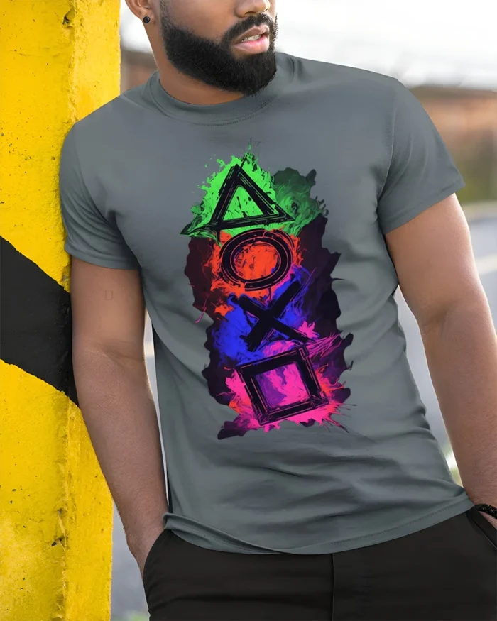 Colorful Gamer Controller Symbols Graphic T-shirt - model in grey shirt leaning against column
