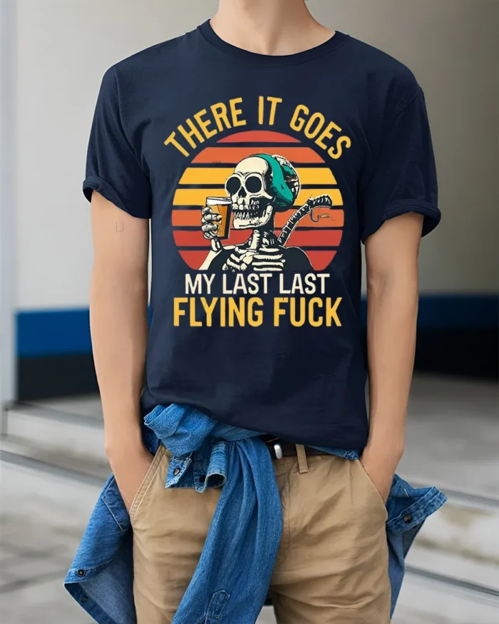 Skeleton Retro Sunset Funny Drinking Graphic T-Shirt - model wearing navy shirt, hands in pockets