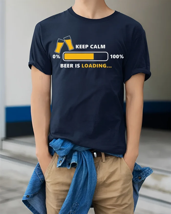 Keep Calm Beer Is Loading Funny Drinking T-Shirt - model wearing navy shirt, hands in pockets