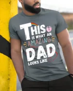 This Is What an Amazing Dad Looks Like T-Shirt - model in grey shirt leaning against column