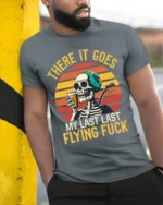 Skeleton Retro Sunset Funny Drinking Graphic T-Shirt - model in grey shirt leaning against column