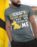 Sorry I’m Late My Dog Was Sitting On Me T-Shirt - model in grey shirt leaning against column