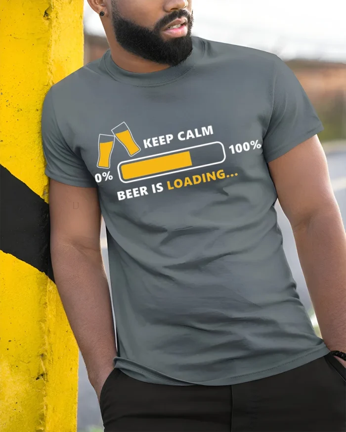 Keep Calm Beer Is Loading Funny Drinking T-Shirt - model in grey shirt leaning against column