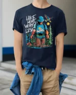 Hike More Worry Less Mountain Adventure T-shirt - model wearing navy shirt, hands in pockets