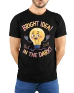 Funny Bright Idea Light Bulb Cartoon T-shirt - model wearing black shirt, hands behind back