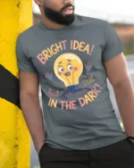 Funny Bright Idea Light Bulb Cartoon T-shirt - model in grey shirt leaning against column