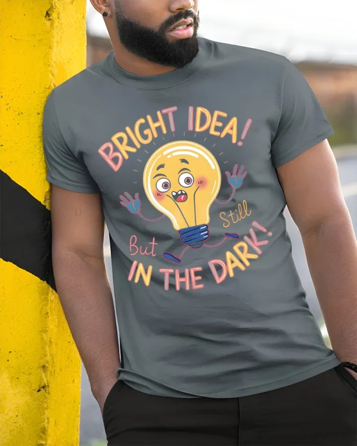 Funny Bright Idea Light Bulb Cartoon T-shirt - model in grey shirt leaning against column
