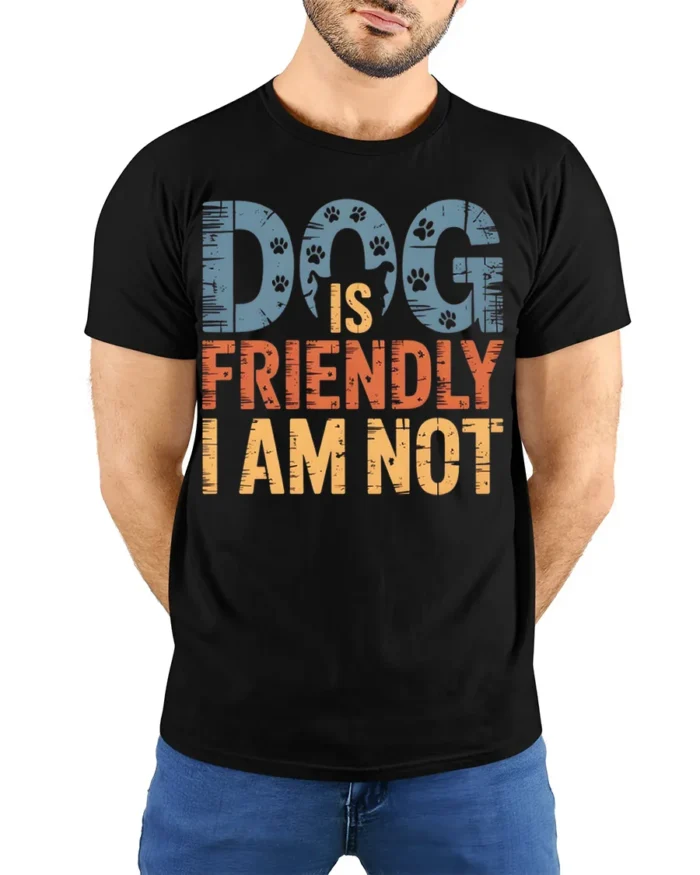 Dog Is Friendly I Am Not Funny Graphic T-Shirt - model wearing black shirt, hands behind back