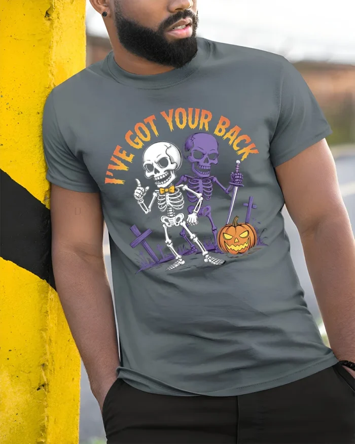 I’ve Got Your Back Funny Skeleton Halloween T-Shirt - model in grey shirt leaning against column
