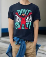 Funny Red Monster Don’t Touch My Stuff T-Shirt - model wearing navy shirt, hands in pockets