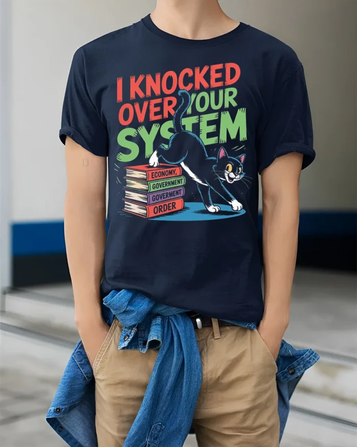 Funny Cat I Knocked Over Your System T-Shirt - model wearing navy shirt, hands in pockets