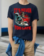 It’s Never Too Late Skeleton Surfer Graphic T-Shirt - model wearing navy shirt, hands in pockets