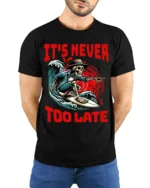 It’s Never Too Late Skeleton Surfer Graphic T-Shirt - model wearing black shirt, hands behind back