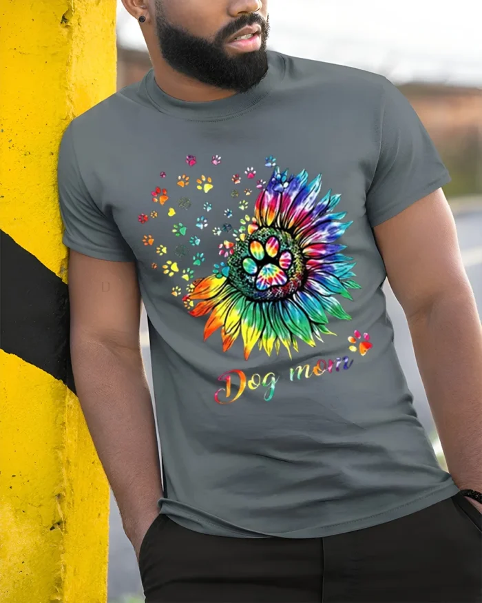 Colorful Dog Mom Paw Print Sunflower Graphic T-Shirt - model in grey shirt leaning against column