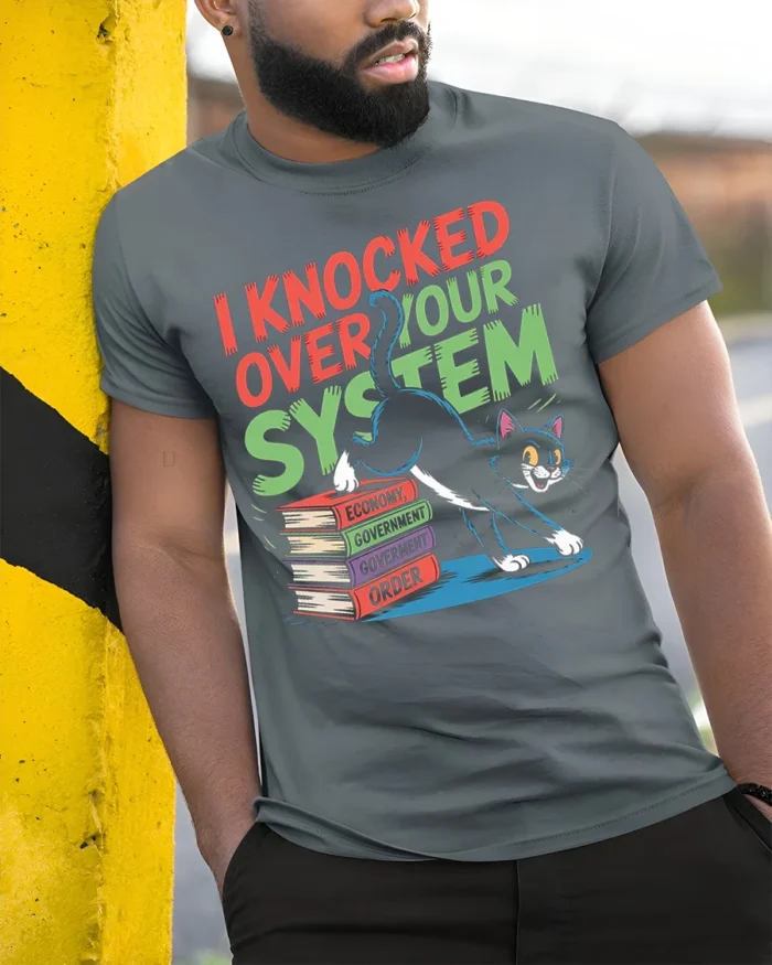 Funny Cat I Knocked Over Your System T-Shirt - model in grey shirt leaning against column