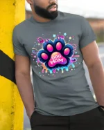 Neon Dog Mom Paw Print Colorful Graphic T-Shirt - model in grey shirt leaning against column