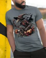 Halloween Evil Scarecrow Raven Pumpkin T-Shirt - model in grey shirt leaning against column