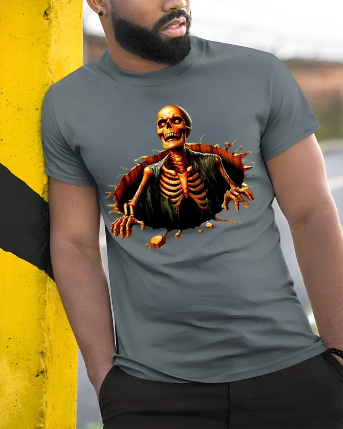 Halloween Skeleton Breaking Wall Graphic T-Shirt - model in grey shirt leaning against column